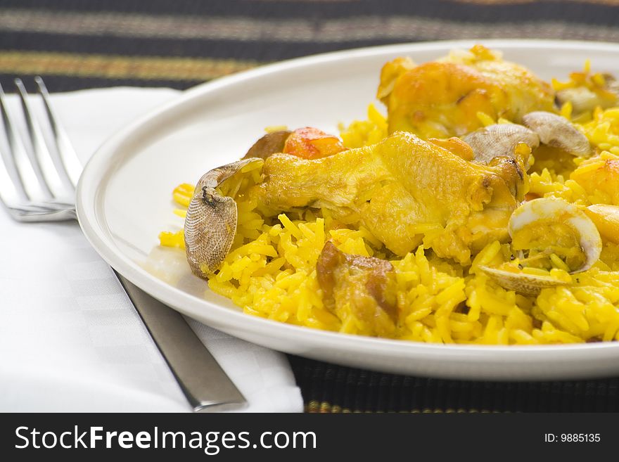 Delicious seafood paella and chicken rice yellow isolated