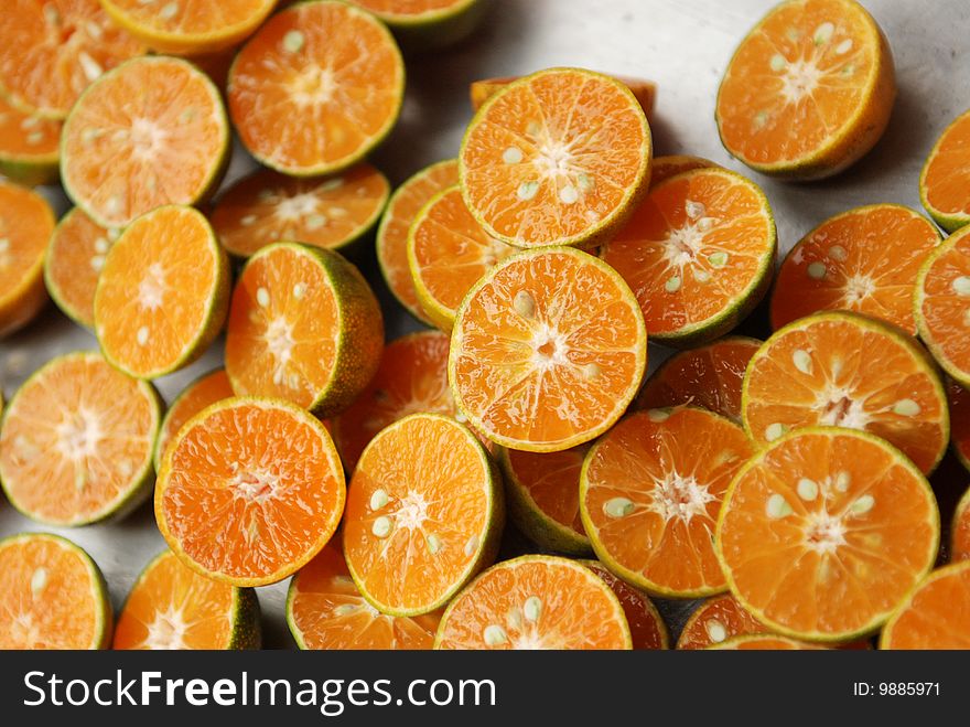 Sliced tangerines found at a fresh fruit market in Thailand. Sliced tangerines found at a fresh fruit market in Thailand