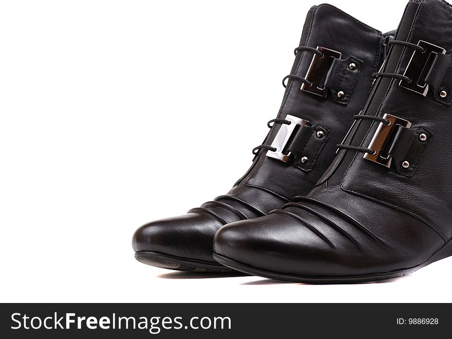 Stylish female boots of black colour of graceful modern design.