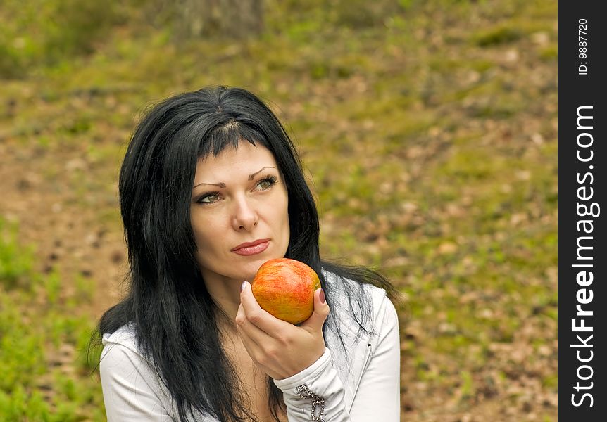 Young girl eating an apple ripe for nature. Young girl eating an apple ripe for nature