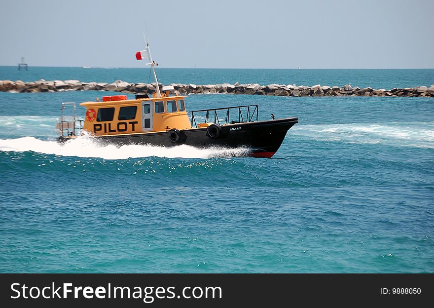 Miami based pilot boat returning to port after escorting a ship to open water. Miami based pilot boat returning to port after escorting a ship to open water.