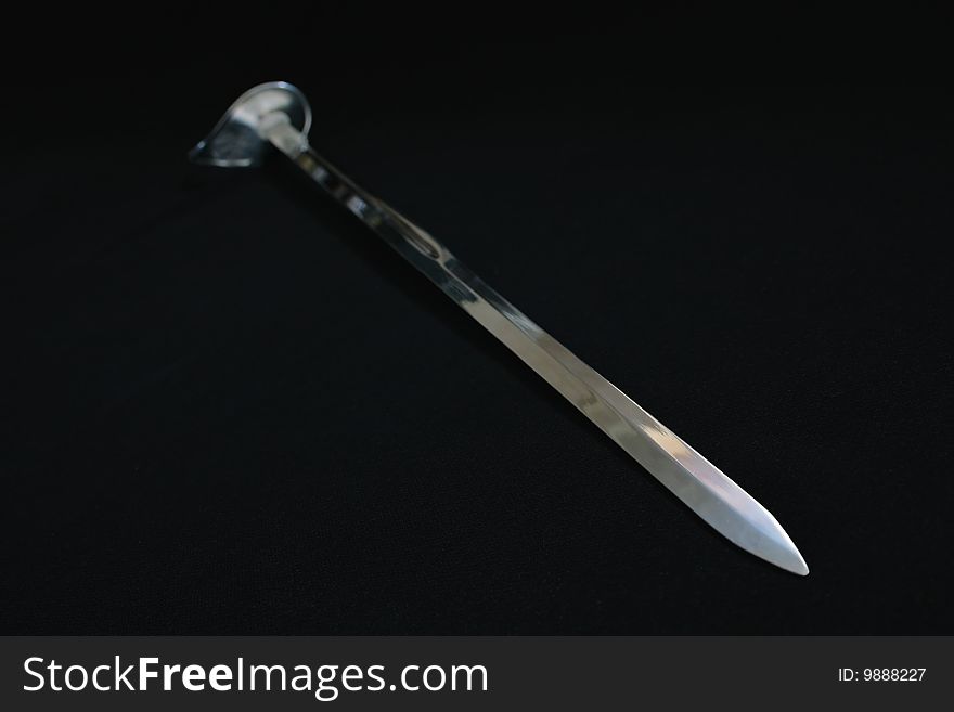 Long metal sword on a black background. Long metal sword on a black background
