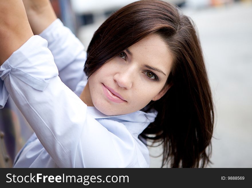 A Beautiful Brunette in a collared shirt with an edge