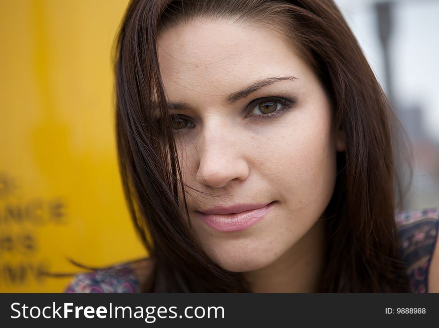 An Edgy Brunette with a yellow background. An Edgy Brunette with a yellow background