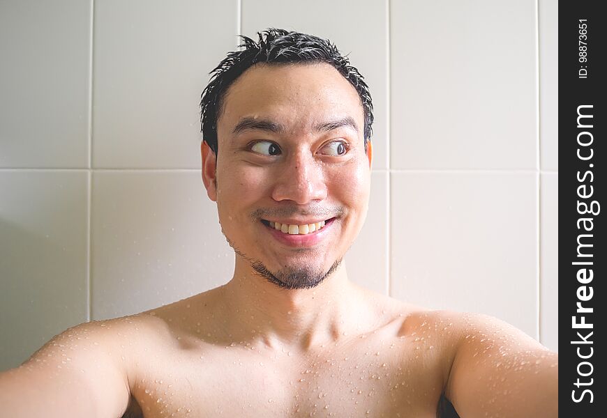 Happy Man Taking Selfie In Bathroom.