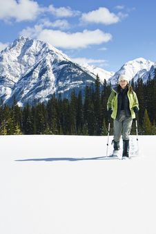 Woman Snowshoeing In The Canadian Rockies Stock Image