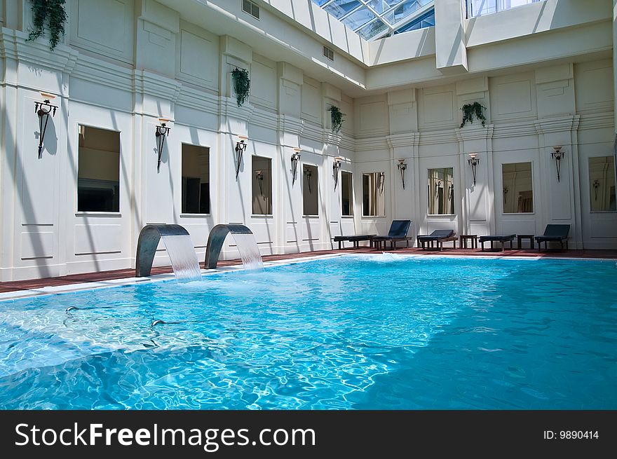 Modern waterfall faucet in a spa swimming-pool