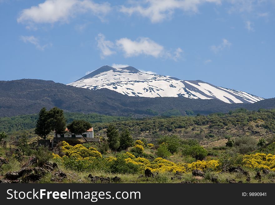 View at volcano Etna. House near volcano. View at volcano Etna. House near volcano.