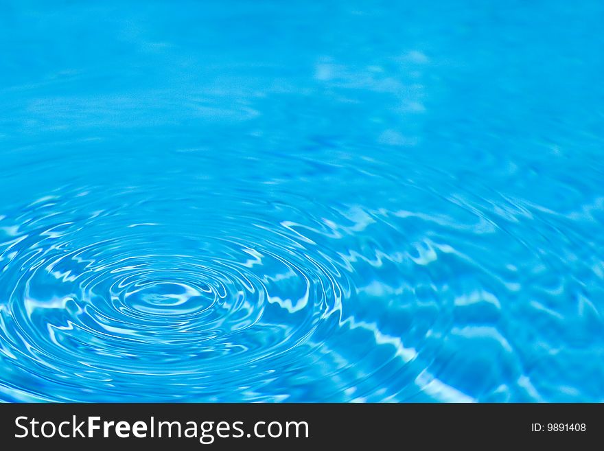 Ripples in a cool blue swimming pool. Ripples in a cool blue swimming pool