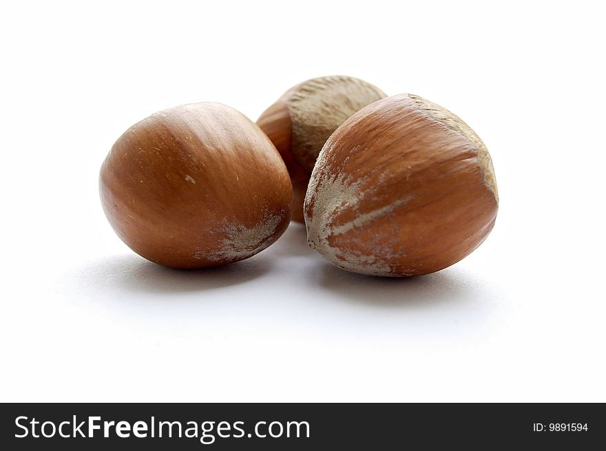 Several walnut and hazelnut on white background. Several walnut and hazelnut on white background