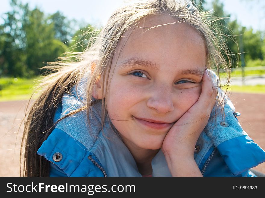 Young girl dreaming in the park