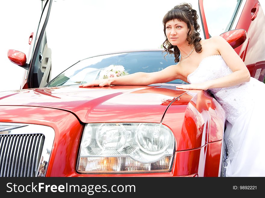 Beauty bride woman with limousine outdoor