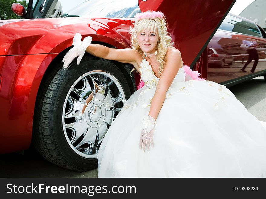 Beauty bride woman with limousine outdoor