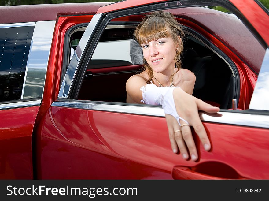 Beauty bride woman with limousine outdoor