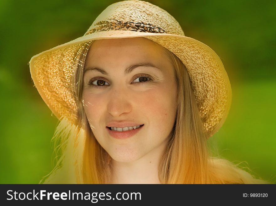 Portrait of smiling female wearing hat - summer scene. Portrait of smiling female wearing hat - summer scene