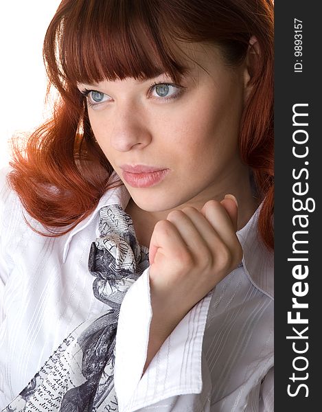 Red haired young woman wearing a shirt and a scarf close-up. Red haired young woman wearing a shirt and a scarf close-up