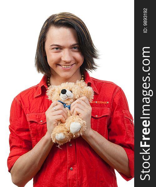 Young guy with his loved  from childhood toy - teddy bear. Isolated over white in studio. Young guy with his loved  from childhood toy - teddy bear. Isolated over white in studio.