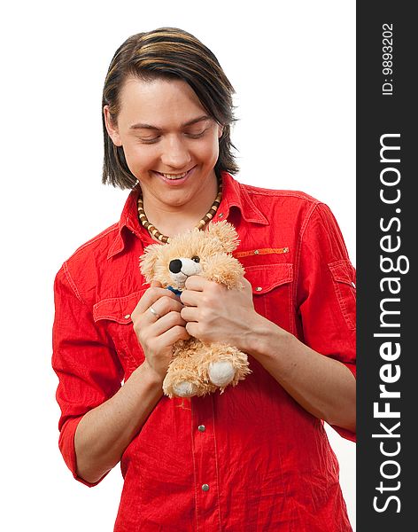 Young guy with his loved from childhood toy - teddy bear. Isolated over white in studio. Young guy with his loved from childhood toy - teddy bear. Isolated over white in studio.