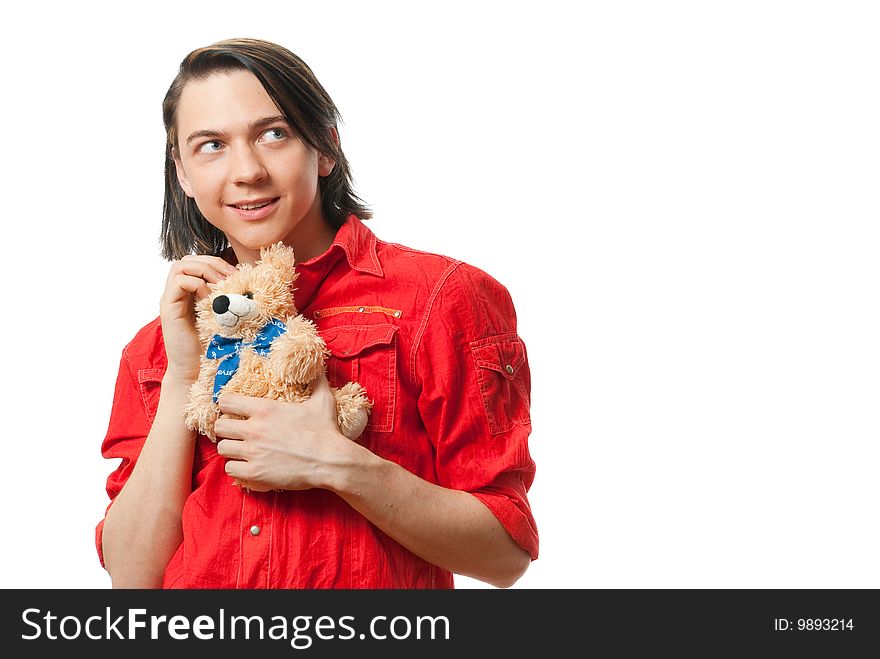 Young guy with his loved  from childhood toy - teddy bear. Isolated over white in studio. Young guy with his loved  from childhood toy - teddy bear. Isolated over white in studio.