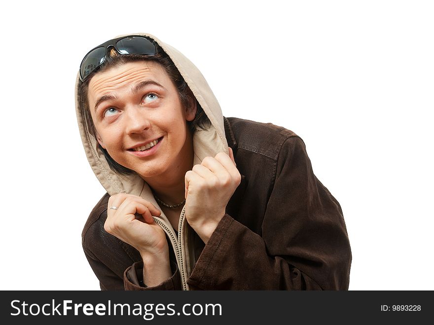 Young guy  in a hood. He thinks that a rain will be now. Isolated over white in studio.