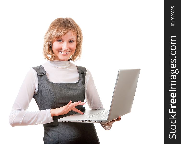 Cute blonde with laptop isolated over white in studio.