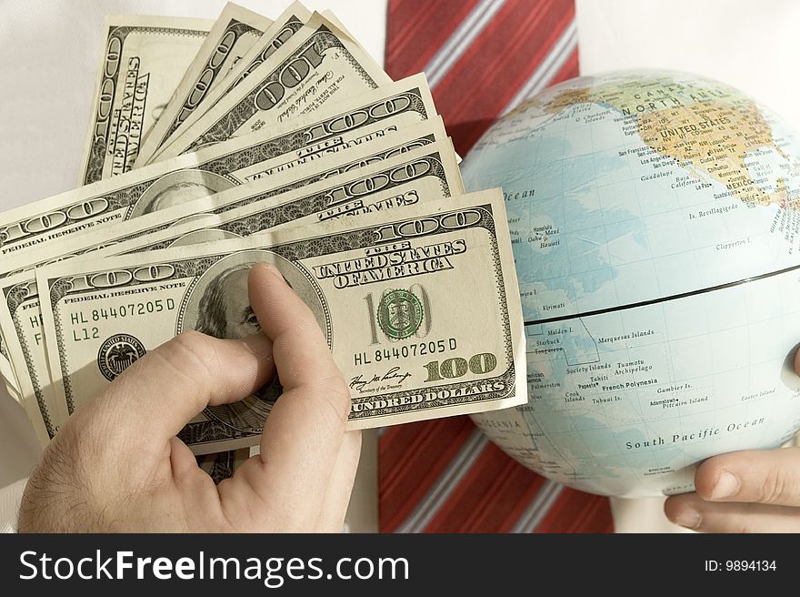 Business men with many banknotesand a globe