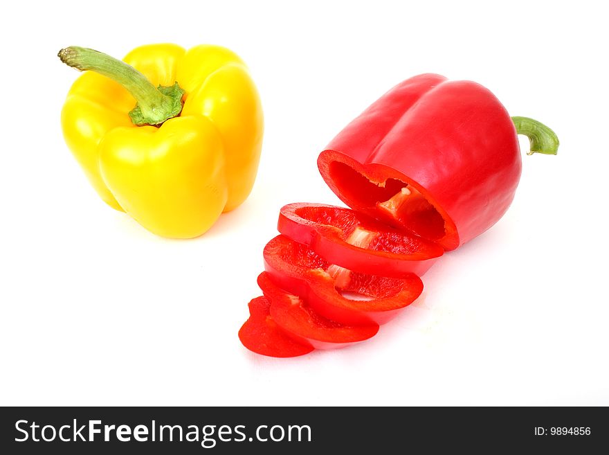 Fresh red and yellow paprika photographed on white background. Fresh red and yellow paprika photographed on white background