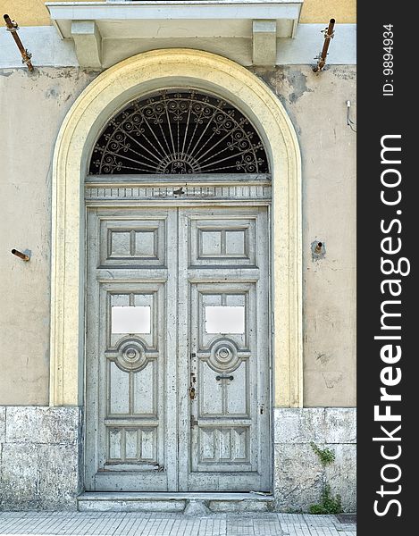 Old Italian door with two empty signs for text. Copy space. Old Italian door with two empty signs for text. Copy space.