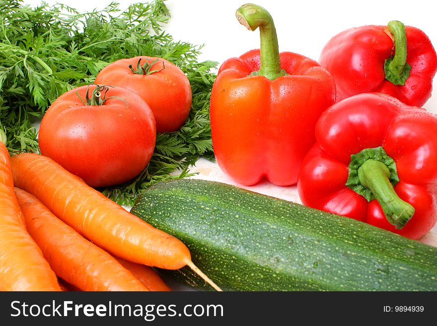 Different vegetables photographed on white background. Different vegetables photographed on white background