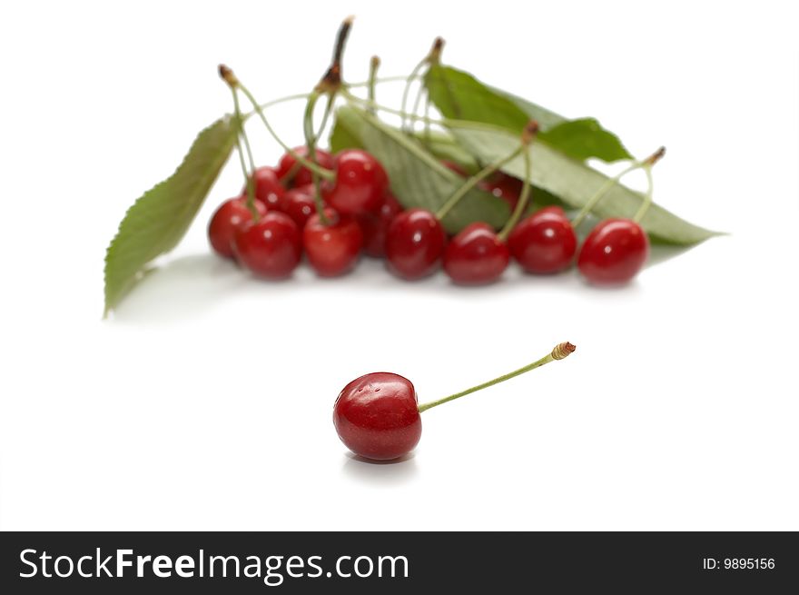 Red riped cherry on white background