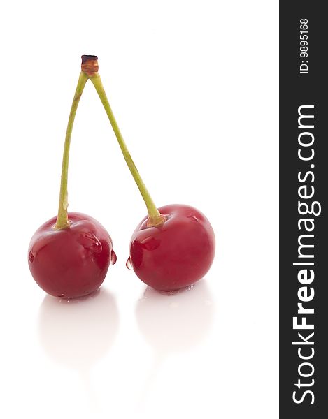 Red riped cherry on white background