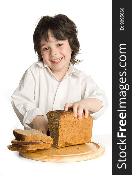 The Liitle Boy Wich Slicing A Bread On Desk