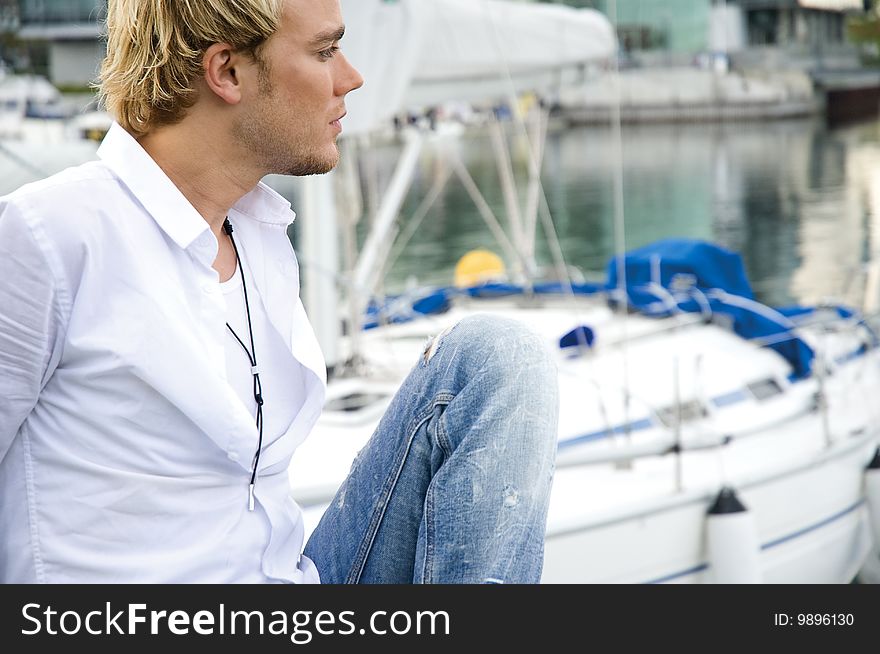Young Man At A Yachtclub