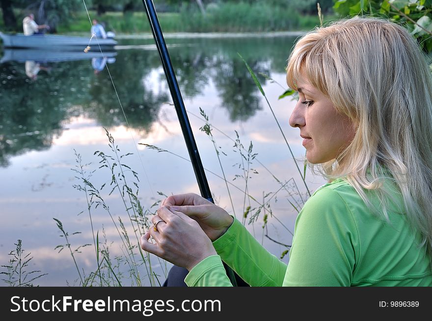 The girl fishes on the Dnieper river. The girl fishes on the Dnieper river