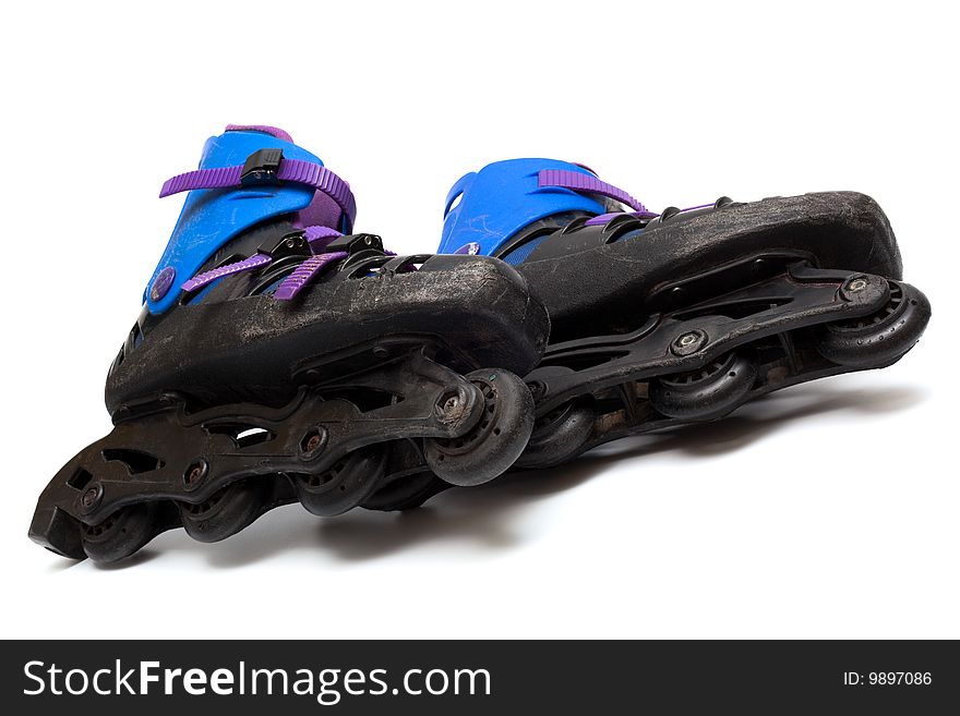 Old roller skates on a white background