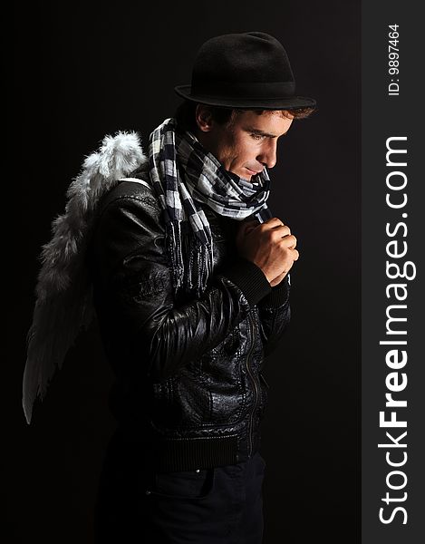 Portrait of a man in leather jacket with angel wings. Portrait of a man in leather jacket with angel wings