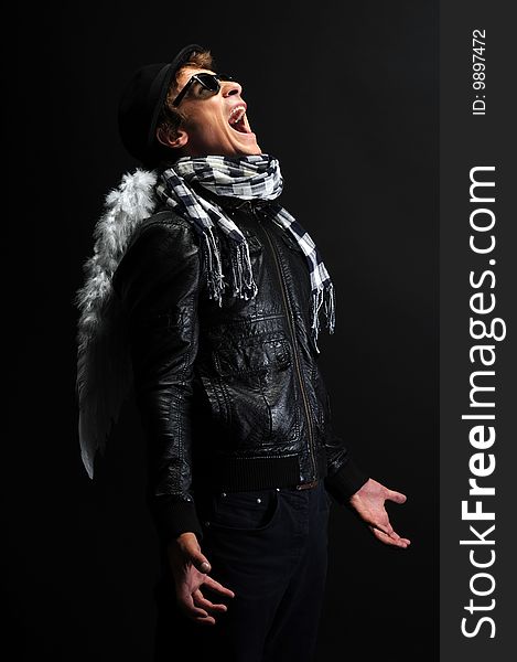 Portrait of a man in leather jacket with angel wings. Portrait of a man in leather jacket with angel wings