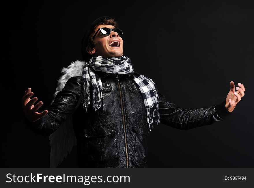 Portrait of a man in leather jacket with angel wings. Portrait of a man in leather jacket with angel wings