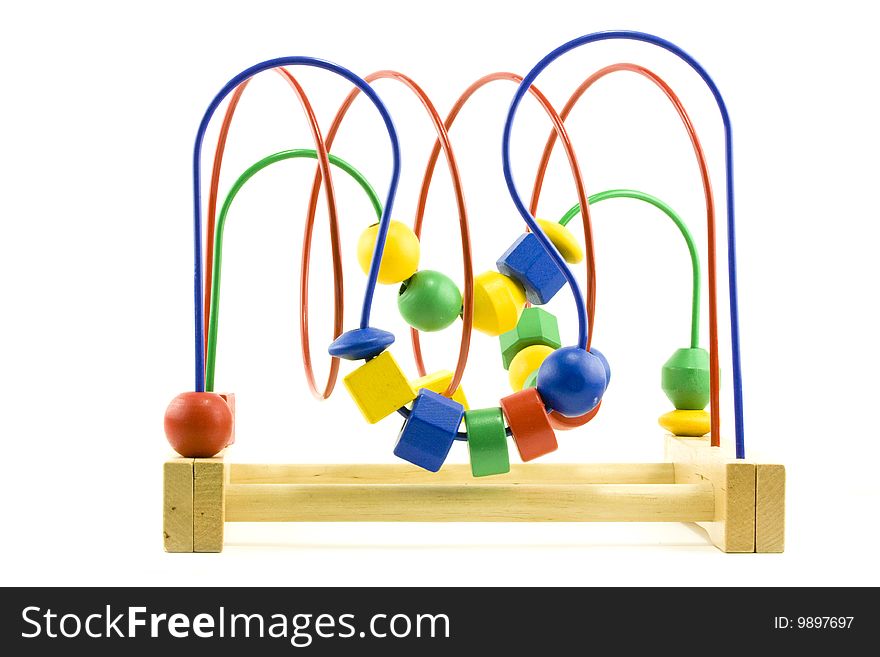 A toddlers wooden toy learning to push beads. A toddlers wooden toy learning to push beads
