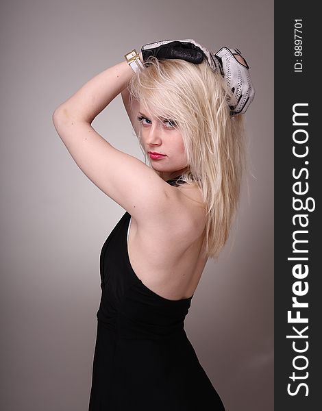 Beautiful blond fashion model posing in studio. Beautiful blond fashion model posing in studio