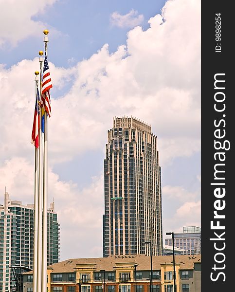 The sky is the background for the new high rise buildings and flags in Atlanta Georgia. The sky is the background for the new high rise buildings and flags in Atlanta Georgia.