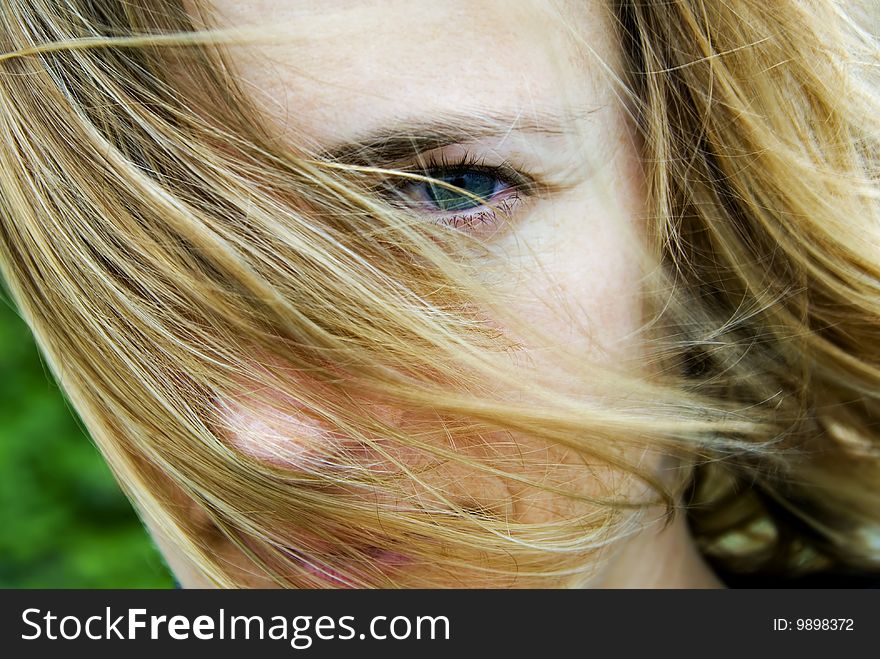 Close-up of a young woman. Intense look. Moody feel. Close-up of a young woman. Intense look. Moody feel