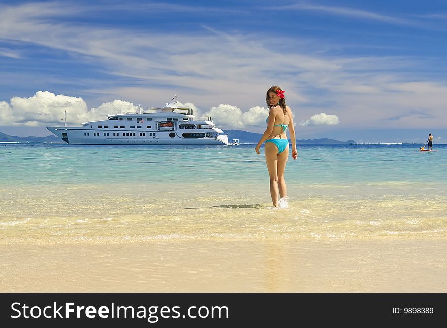 Girl on a sandy beach, Huahine Island, French Polynesia