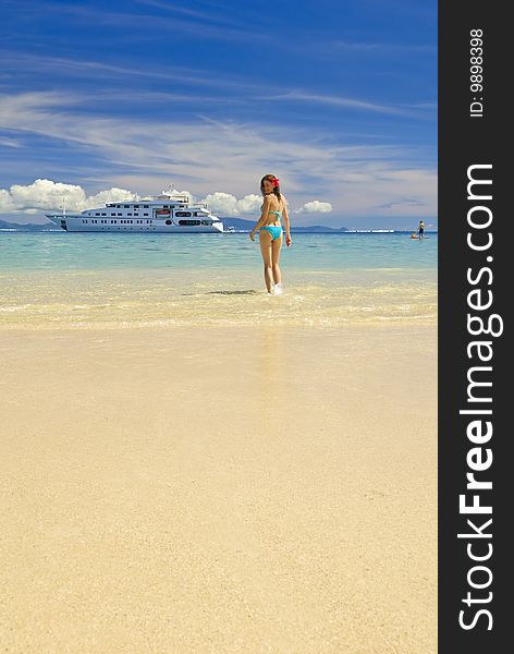 Girl on a sandy beach, Huahine Island, French Polynesia