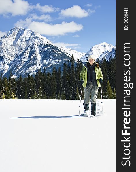 Woman snowshoeing in the Canadian rockies