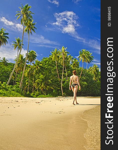 Girl on a sandy beach, Huahine Island, French Polynesia