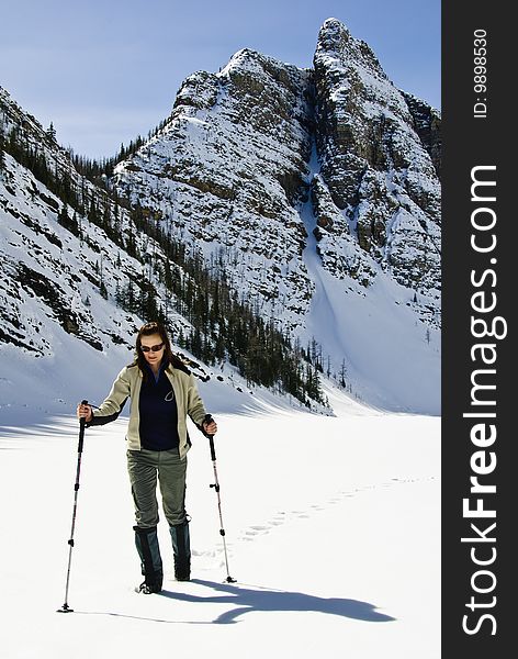 Woman snowshoeing in the Canadian rockies