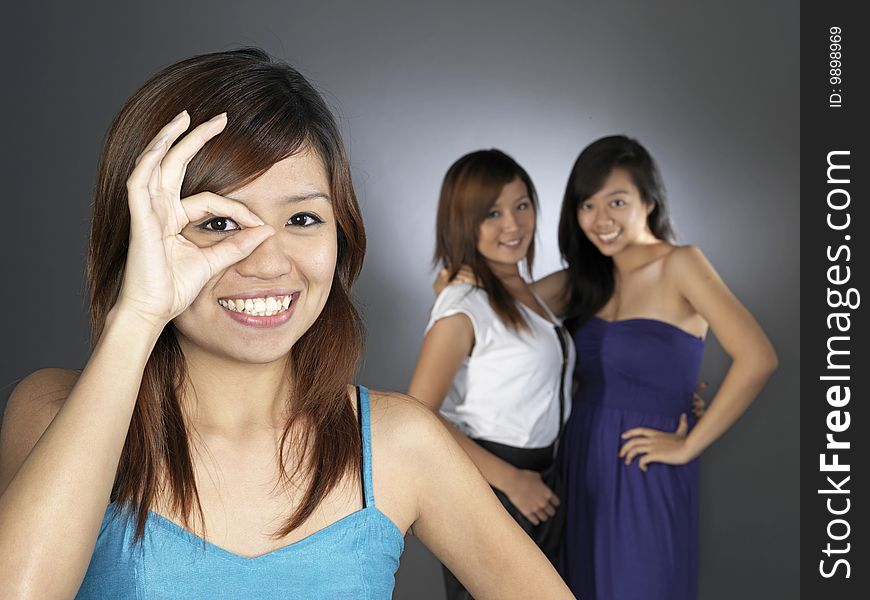 Three Beautiful Young Asian Women In Dresses. Three Beautiful Young Asian Women In Dresses.