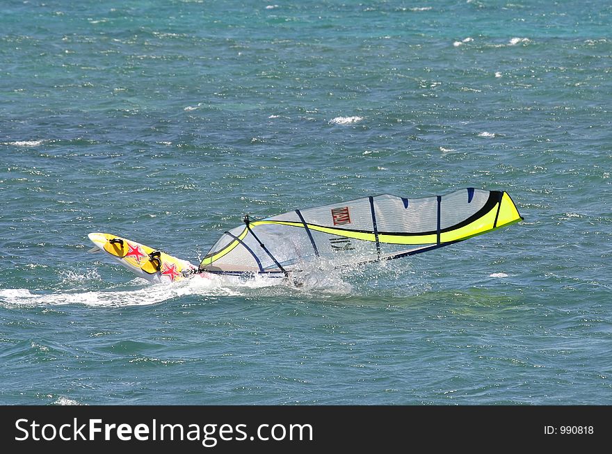 A Windsurfer Capsizes At Speed