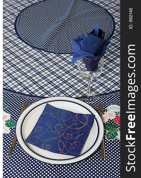 Dinner plate and glass set up for one to din, blue theme. Dinner plate and glass set up for one to din, blue theme